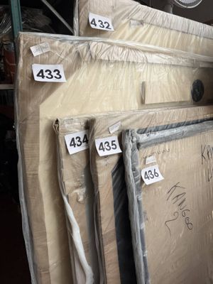a lot of boxes of mattresses in a warehouse