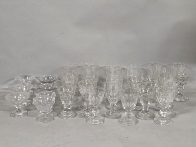 a lot of glasses that are sitting on a table