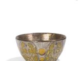 an image of a silver bowl with yellow flowers on it