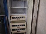 a refrigerator that has a lot of drawers inside of it