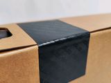 an open box with a phone inside of it sitting on a table