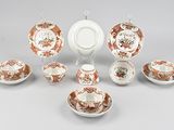 many different types of tea cups and saucers on the table