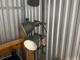 a bed with a wooden frame and a lamp next to it
