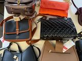 a lot of purses that are on a table