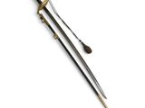 a close up of a sword on a white surface