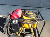 a small cart with a bag of tools on top of it