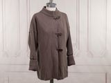 an image of a coat on a mannequin stand