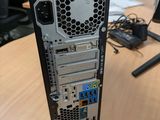 a computer tower sitting on top of a wooden table