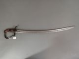 a sword that is laying on a table