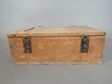 an old wooden box with a metal latch on it