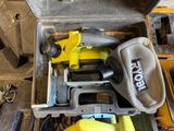 a tool box with tools inside of it on the floor