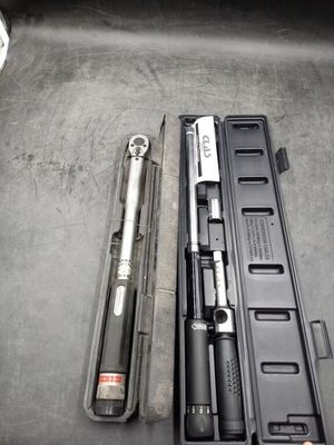 two tools in a case sitting on a table