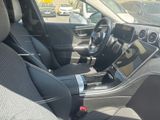 the interior of a car with black seats and a steering wheel