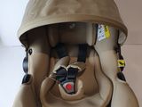 a baby car seat that is attached to the back of a stroller