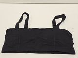 black sports bra top with adjustable straps on a white surface
