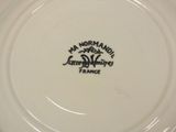 an image of a white plate with a black design on it