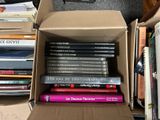 a box full of books sitting on the floor