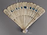 an old fan is hanging on a wall with a string