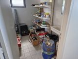 a room with a lot of food on the shelves