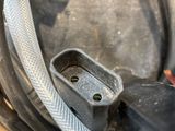 a close up of a hose connected to a motorbike