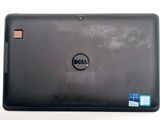 laptop computer with dell logo on screen sitting on a white surface