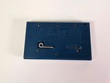 a small blue device on a table with a white background