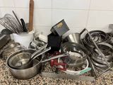 many pots and pans on the counter in the kitchen