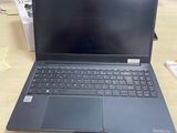 a laptop that is sitting on a desk in front of a monitor