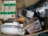 a cardboard box full of appliances and other household items