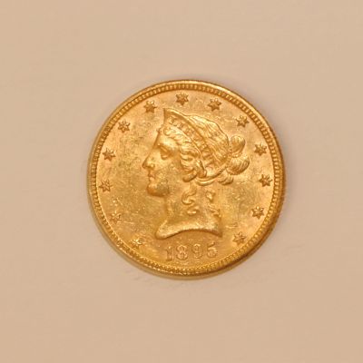 an image of a gold coin with a woman ' s head on it