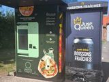 two vending machines that are on the side of the road