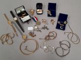 many different types of jewelry on the table