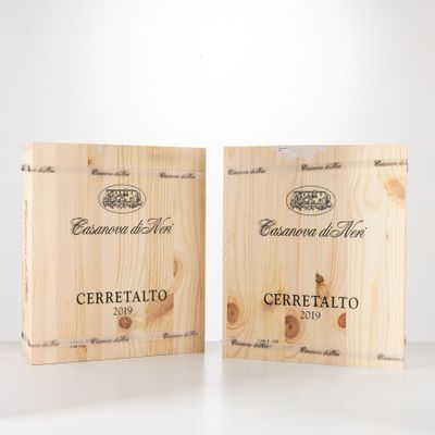 two wooden boxes of wine sitting on a table