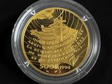 a close up of a gold coin with a black background