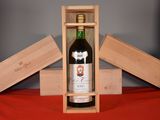 a bottle of wine in a wooden box on a table