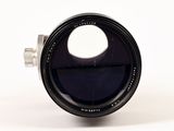 an image of a close up of a camera lens on a white surface