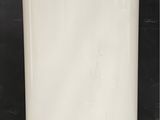 an image of a white water heater sitting on top of a counter