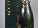bottles of champagne and a box on a grey surface