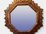 a mirror that is hanging on the wall in the room