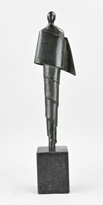 statue of a man with a hat on his head on a marble base