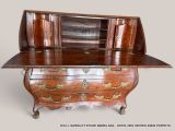 a small desk with a wooden top and drawers on it