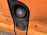 a close up of a car door handle with a hole in it