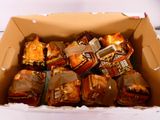 a cardboard box filled with a variety of food items