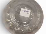 a glass bowl with a label on it on a white surface