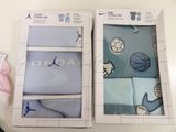 two boxes of blue and white socks with basketball designs on them