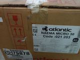 the box is sitting on the floor in front of the wall
