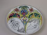 a plate with a drawing of a woman and a man