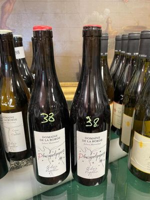 several bottles of wine on a table with a glass top
