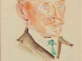 portrait d'un homme en costume avec une cravate verte