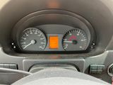 a close up of a car dashboard with a speedometer and gauges